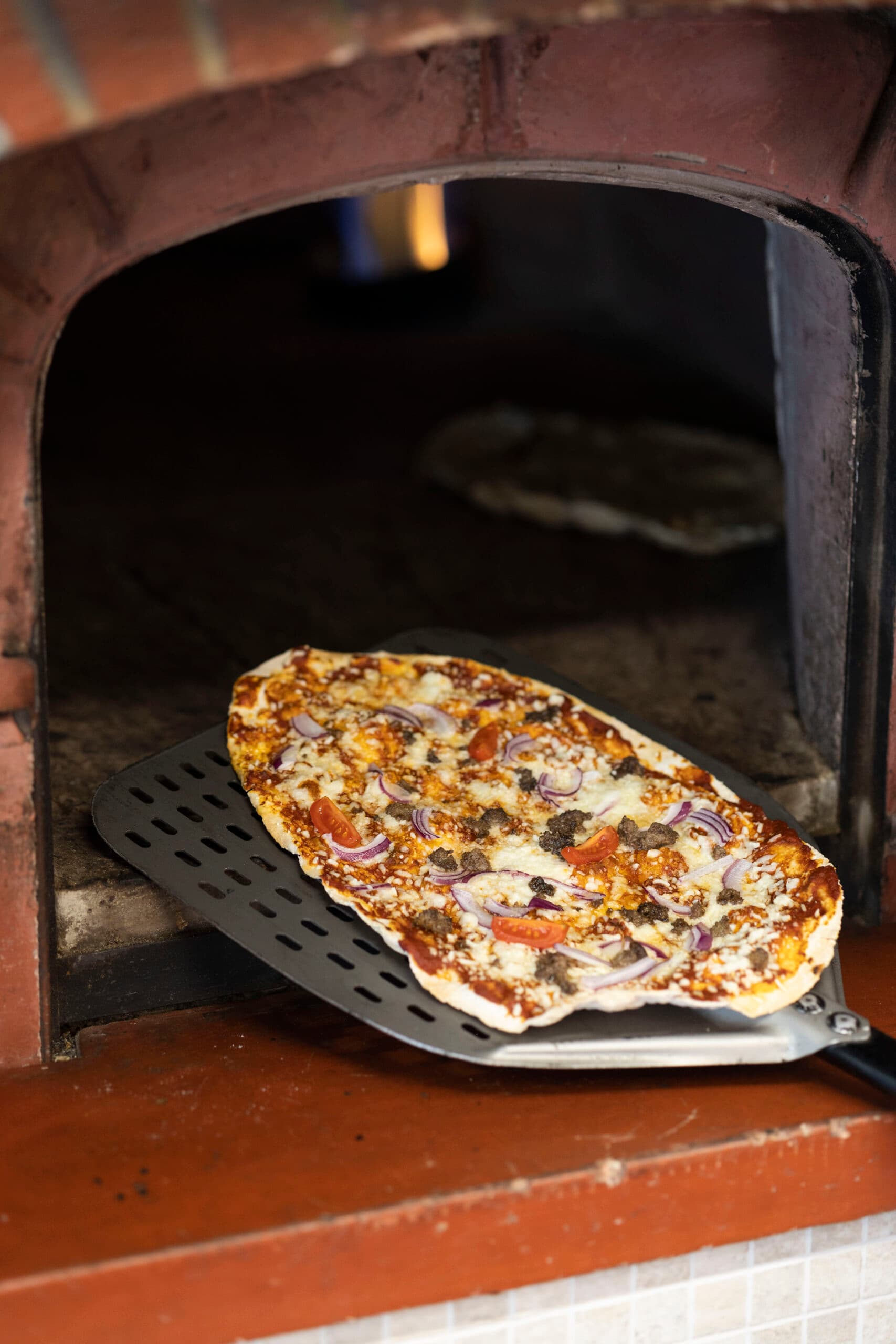 Takkesteikte pizzabotnar frå Lega